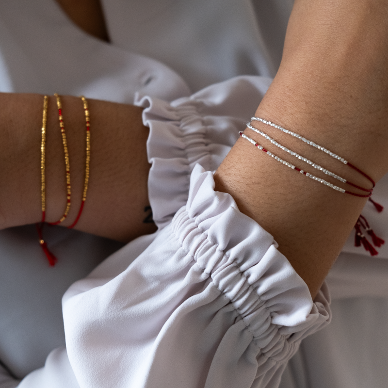 Delicate gold bracelet - red silk cord