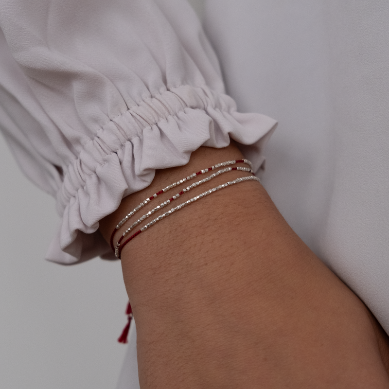 Delicate gold bracelet  with silk cord