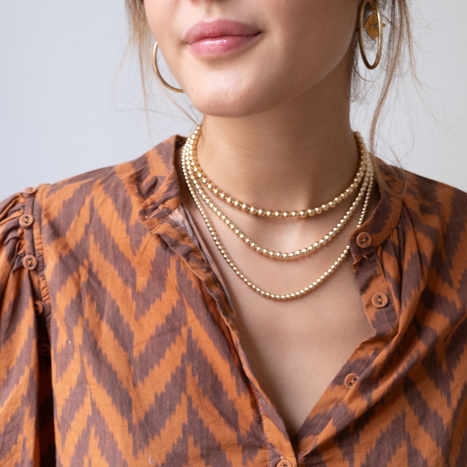 Gold beads necklace designs discount