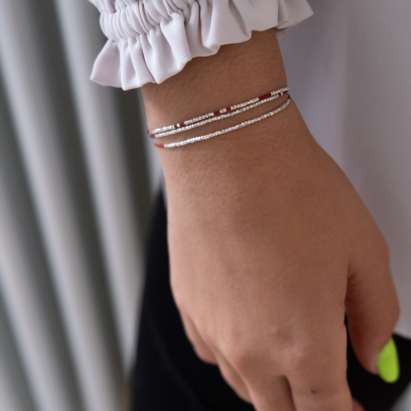 Delicate gold bracelet  with silk cord