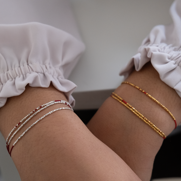 Delicate gold bracelet - red silk cord