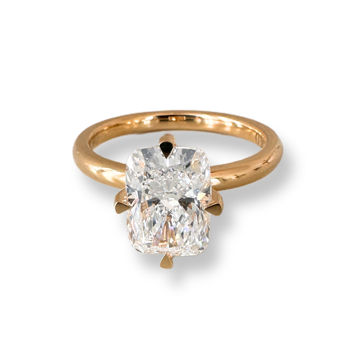 Diamond engagement ring with compass four prong setting