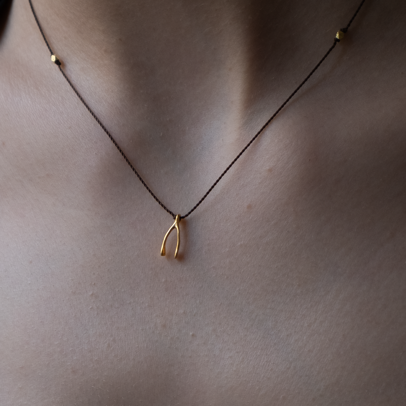 14k gold Wishbone Charm necklace on silk