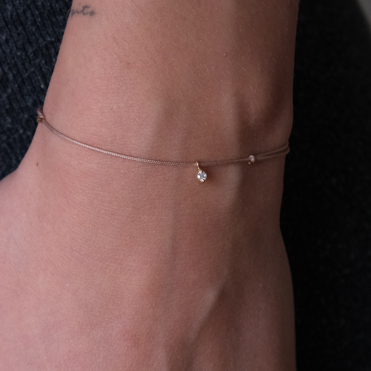 Gold solitaire droplet Bracelet on Cord 14k