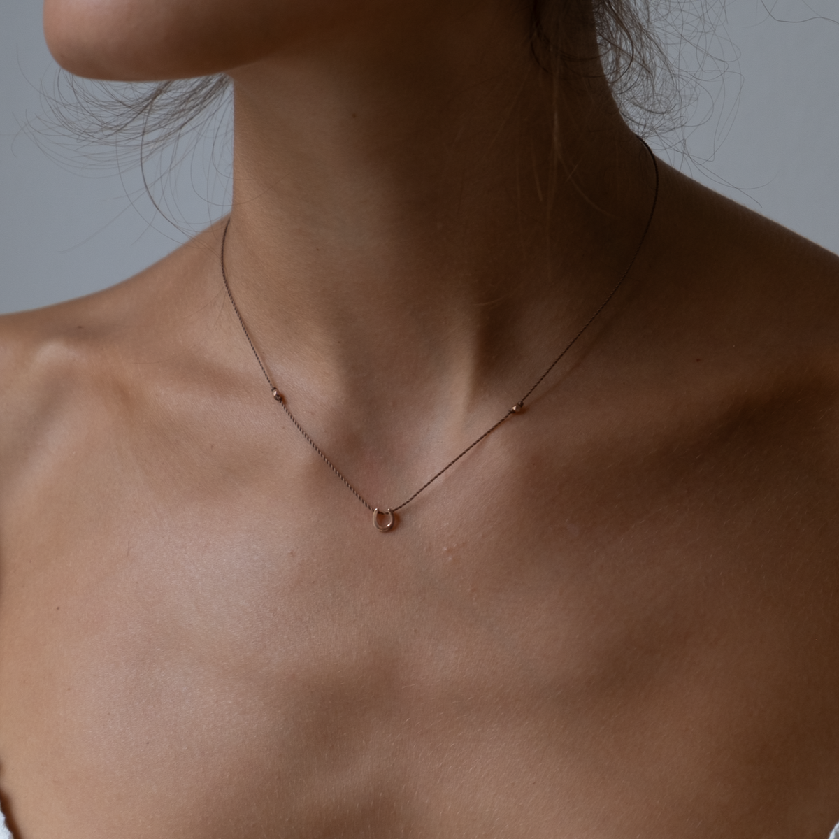 14k gold Horseshoe Charm necklace on silk