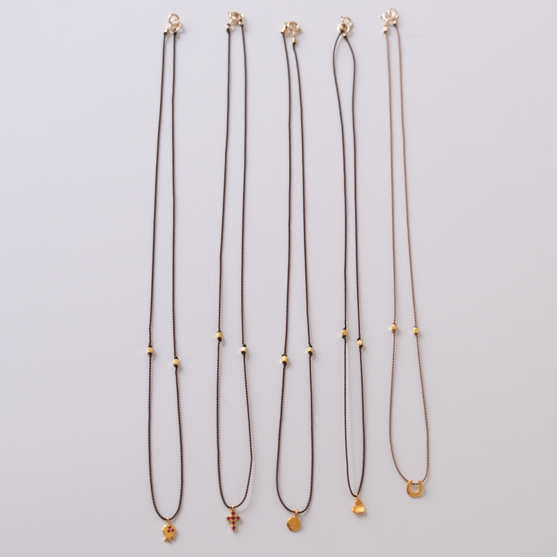 14k gold Wishbone Charm necklace on silk