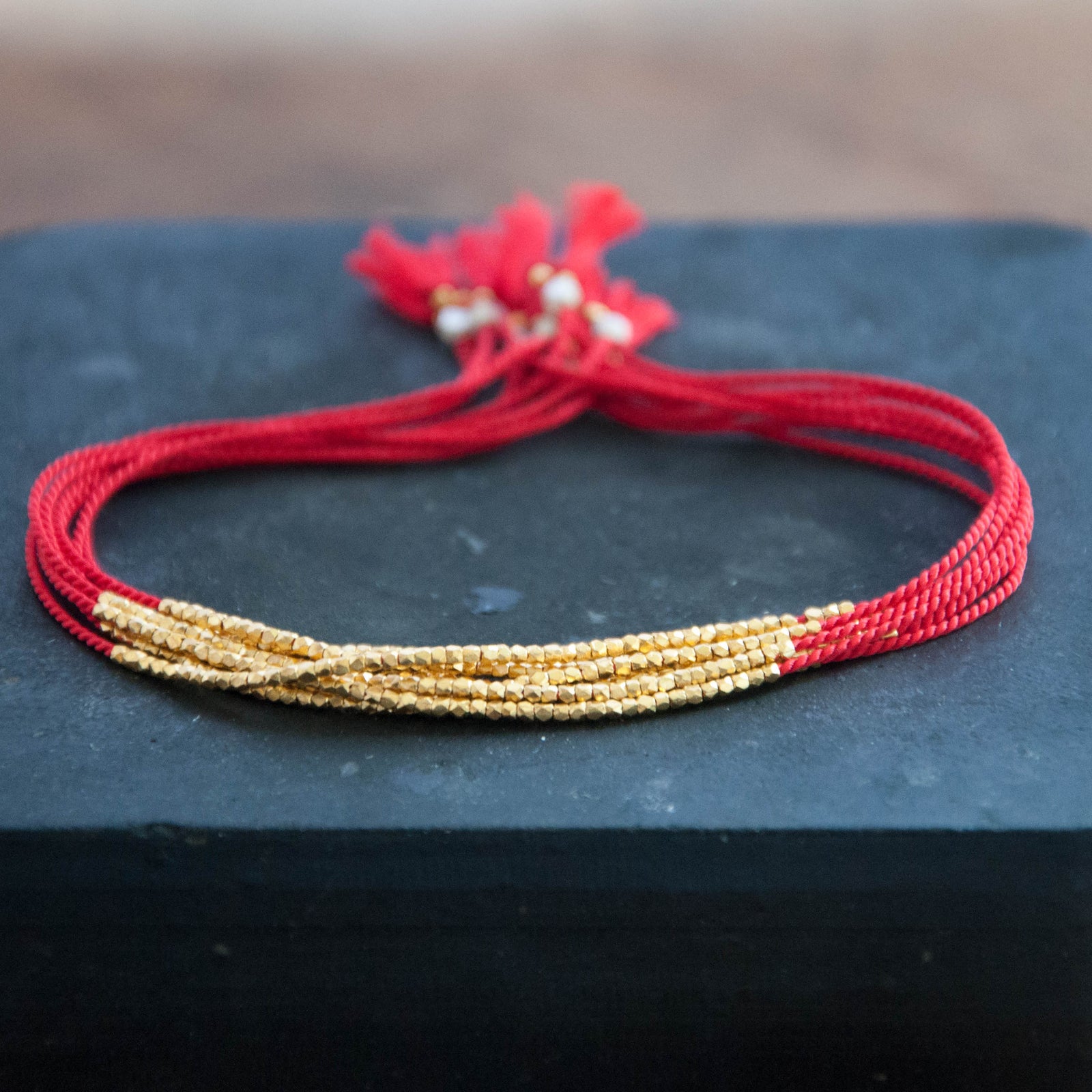Red friendship bracelet clearance